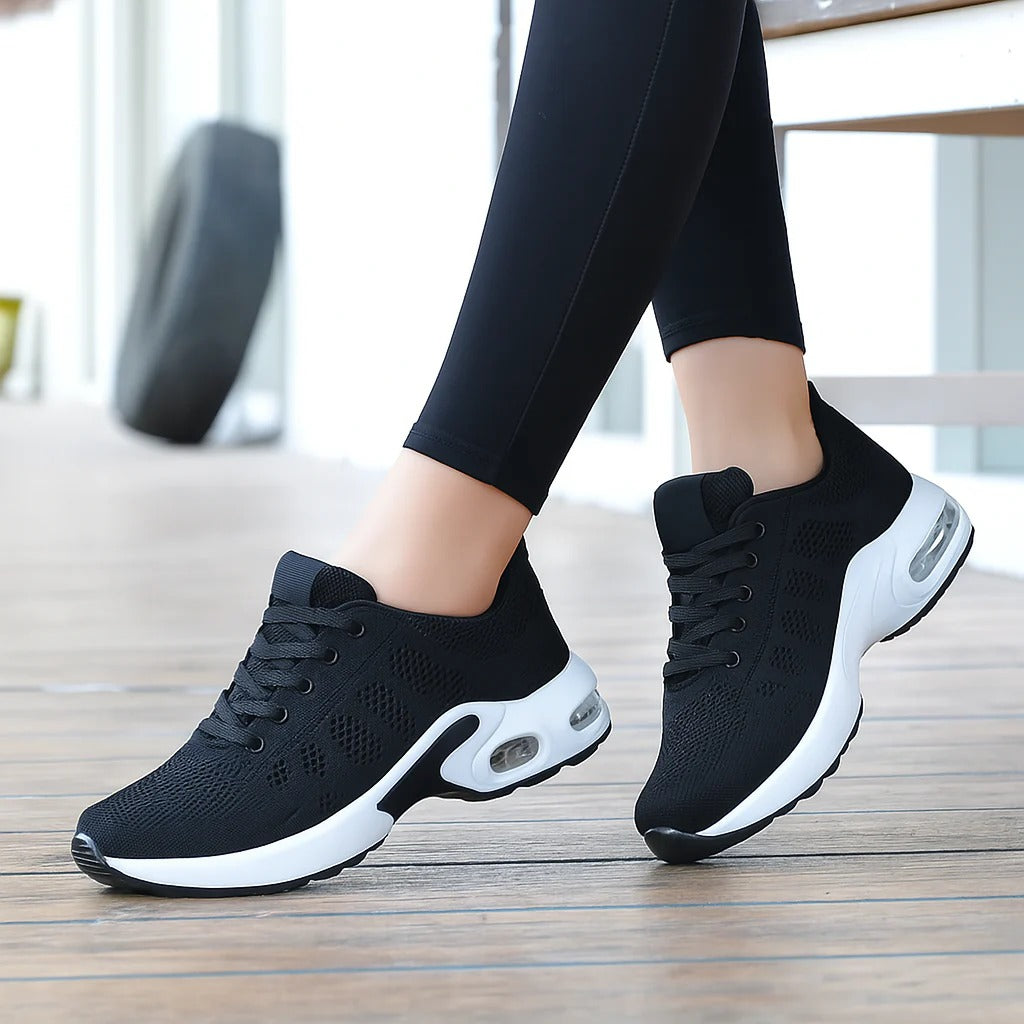 Woman wearing black OrthoStep air cushion walking shoes