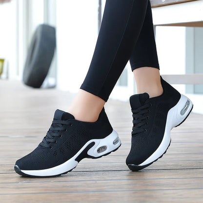 Woman wearing black OrthoStep air cushion walking shoes